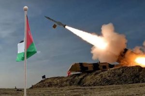 A surface-to-air defense system launching an interceptor missile beside a Jordanian flag, an illustrative representation of regional air defense engagements against incoming ballistic threats.