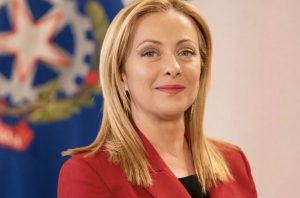 Italian Prime Minister Giorgia Meloni in an official portrait, discussing her government's support for Ukraine
